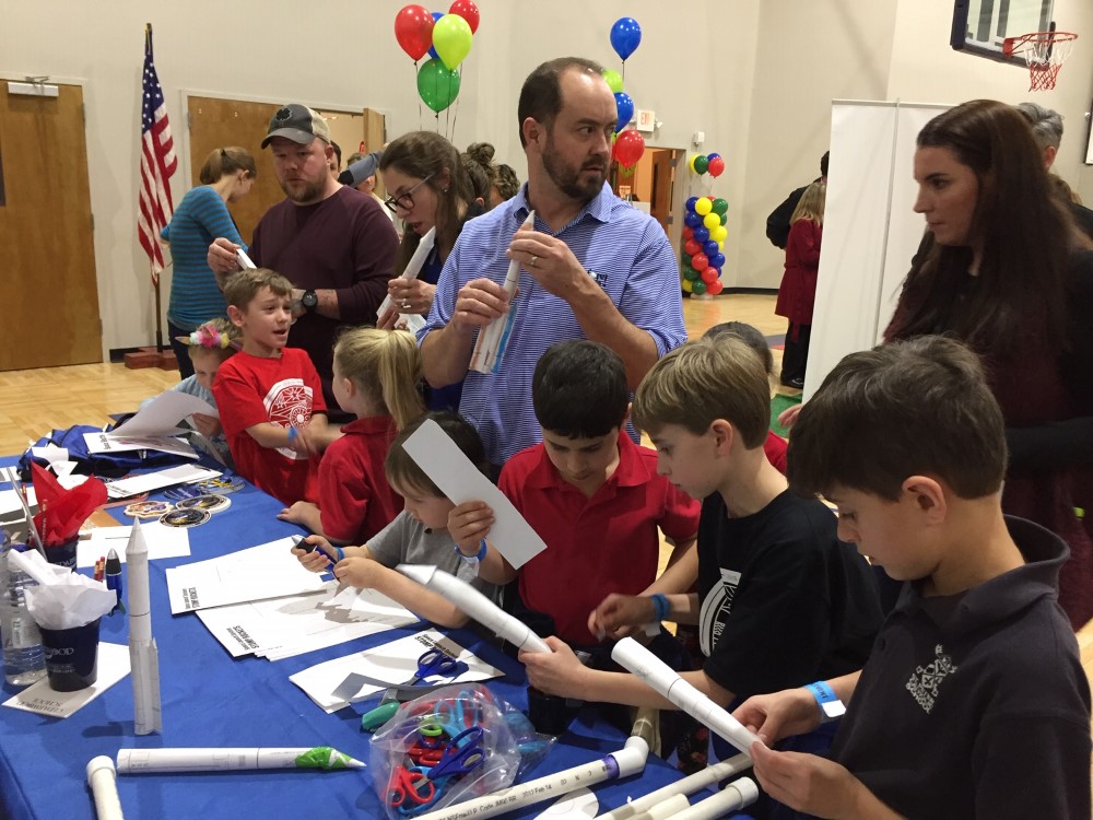 Parents and kids learning rocket science
